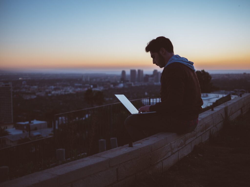 proofread anywhere-man proofreading on rooftoop-avi-richards-Z3ownETsdNQ-unsplash-min
